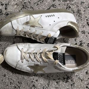 Gently worn white and gold distressed golden goose sneakers.